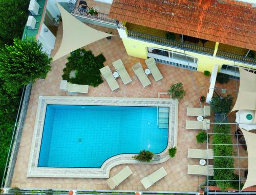 an overhead view of a swimming pool in a resort at Hotel Ape Regina in Ischia