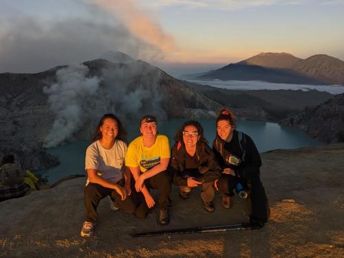 a group of people sitting on top of a mountain at Dannu's Homestay Ijen and Bromo Tour in Banyuwangi