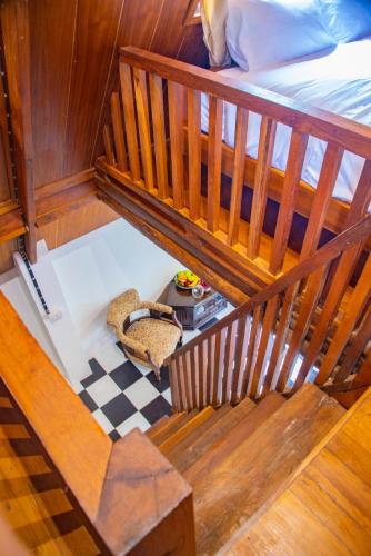 an overhead view of a room with a bed and a chair at Ban Kaew Mo Ra Glamping & Restaurant in Pang Mapha