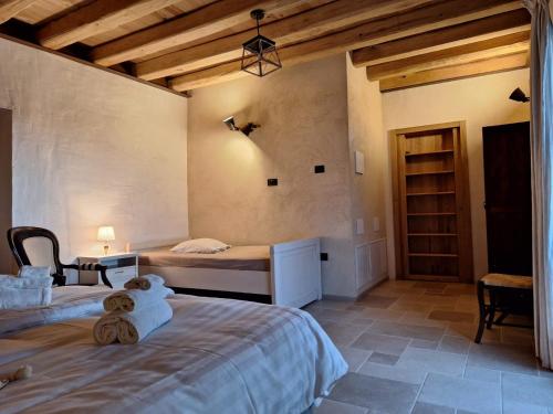 a bedroom with two beds in a room at Agriturismo La Pina in Tarzo