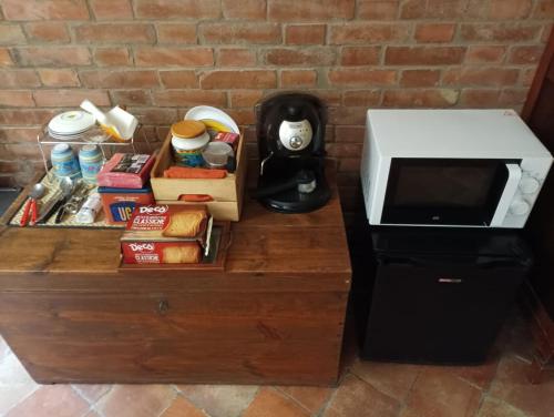 a counter with a microwave and some food on it at B&b Luna in Syracuse