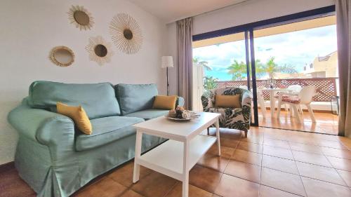 A seating area at Strelitzia Apartment - ocean view & heated pool