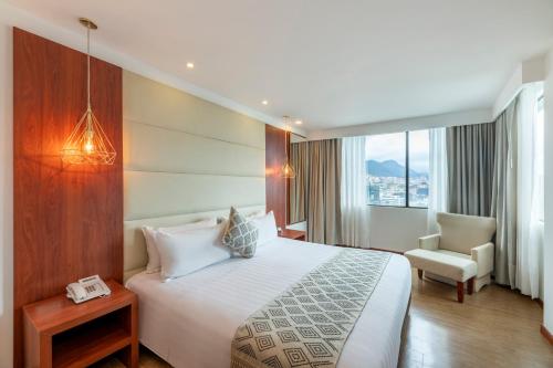 Voodi või voodid majutusasutuse Hotel Andes Plaza toas