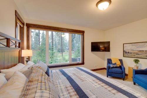 a bedroom with a large bed and a large window at Luxury Home in Suncadia Hot Tub and Fire Pit! in Cle Elum