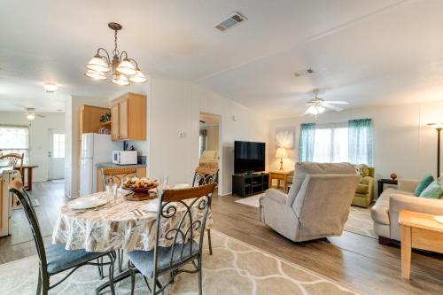 a living room with a dining room table and a kitchen at Weeki Wachee Vacation Rental about 13 Mi to the Ocean! in Spring Hill
