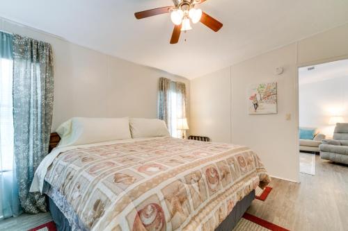 a bedroom with a bed and a ceiling fan at Weeki Wachee Vacation Rental about 13 Mi to the Ocean! in Spring Hill