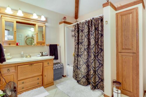 a bathroom with a sink and a shower at Salem Getaway with Hot Tub Near Parks and Boating! in Salem