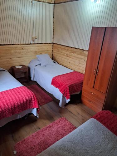 Postel nebo postele na pokoji v ubytování Cabañas Robinson