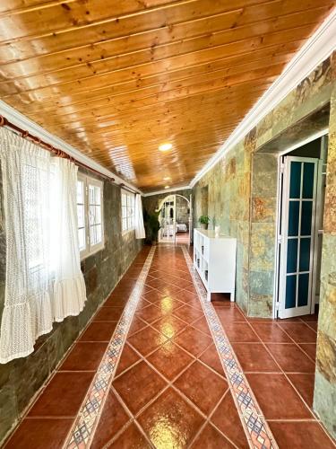 a hallway of a house with a wooden ceiling at Casa Rural en Valsequillo in Las Palmas de Gran Canaria