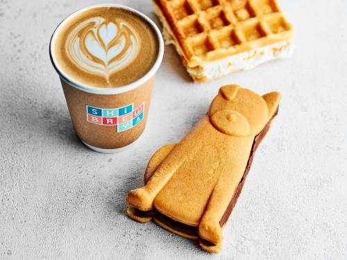 a cup of coffee and waffles and a cup of coffee at Hotel Indigo Tokyo Shibuya in Tokyo