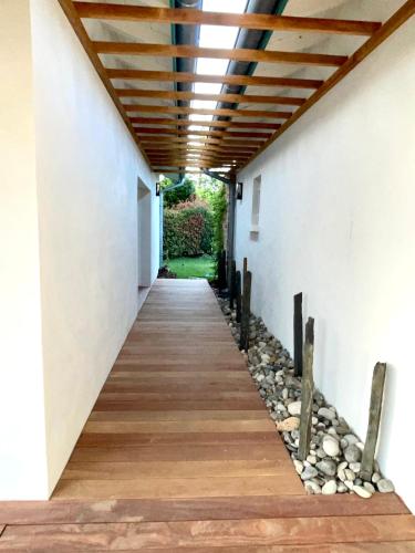 a hallway of a house with a wooden ceiling at HARITZAGA chambre d'hôte terrasse & jardin privé in Biarritz