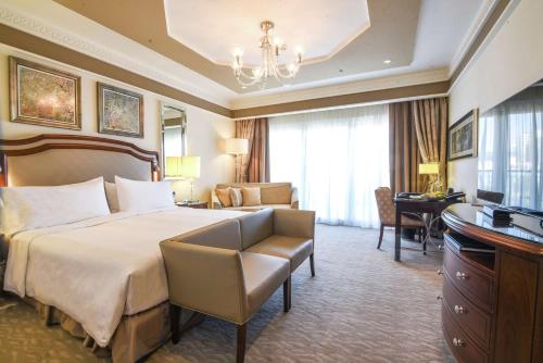 a hotel room with a bed and a desk at Waldorf Astoria Jerusalem in Jerusalem