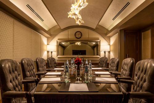 a conference room with a long table and chairs at Waldorf Astoria Jerusalem in Jerusalem