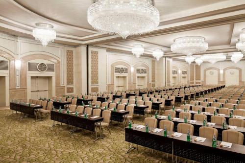 a large room with rows of tables and chairs at Waldorf Astoria Jerusalem in Jerusalem