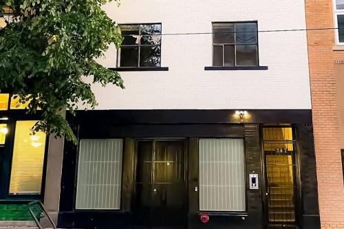 a building with two sets of doors in front of it at Newly Renovated 2 Bedroom Condo in Japantown! Near Railtown & Gastown! in Vancouver