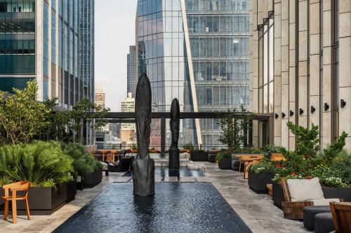 a fountain on the roof of a building at Equinox Hotel New York in New York