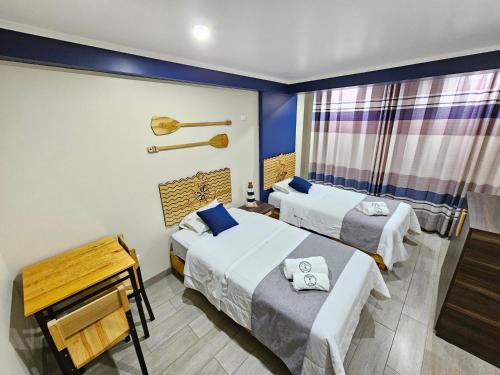 Ліжко або ліжка в номері EL FARO HOTEL