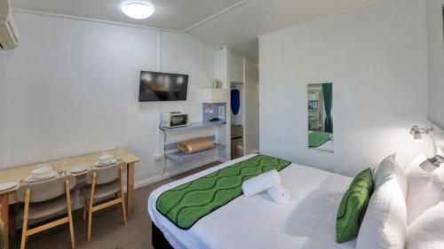 Postel nebo postele na pokoji v ubytování CBD GI Motel