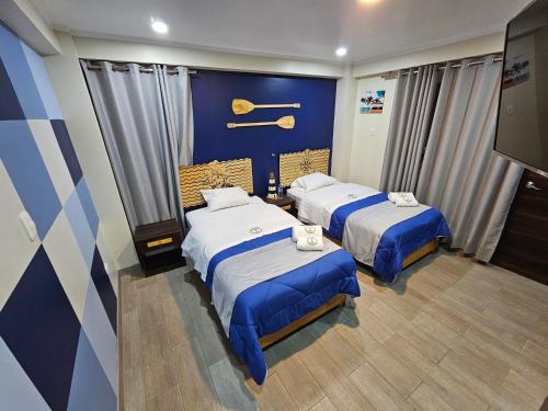 Postel nebo postele na pokoji v ubytování EL FARO HOTEL