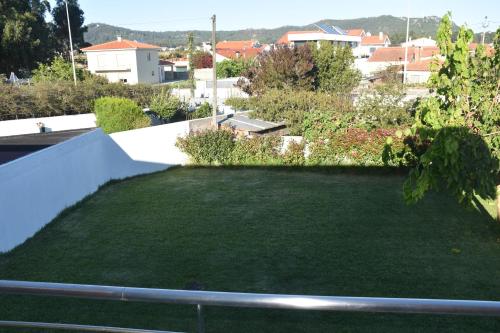 a small garden on the roof of a house at Casa de praia familiar 4 quartos e jardim in Esposende