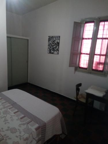 Una cama o camas en una habitación de El Viaje Hostel