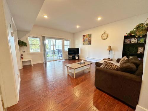 a living room with a couch and a table at Oasis in Victoria