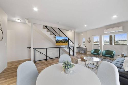 a living room with a white table and a couch at *Brand New* Fully Updated Condo 910 in Anacortes in Anacortes