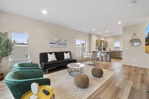 a living room with a couch and a table at *Brand New* Fully Updated Condo 910 in Anacortes in Anacortes