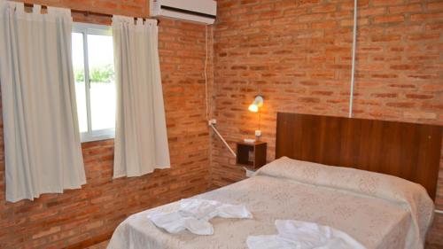 En eller flere senge i et værelse på Holiday Home Alta Vista