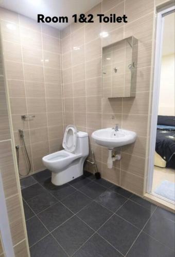 a bathroom with a toilet and a sink at Big House In Alor Setar Taman Sri Ampang in Alor Setar