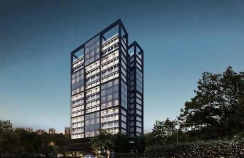 a tall glass building with a lot of windows at Lantana Cosy Home Studio Apartment in Nairobi