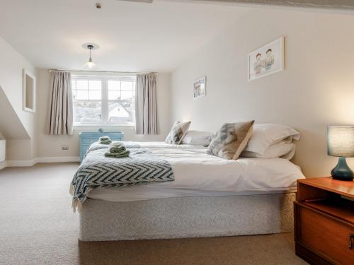 a bedroom with a large bed in a room at Mill View in Aberfeldy