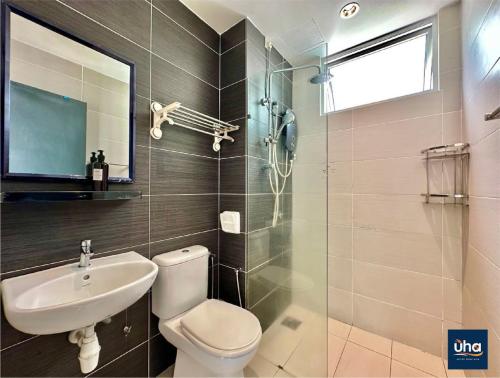 a bathroom with a toilet and a sink and a shower at Midori Green By JK Home in Johor Bahru