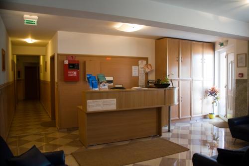 a lobby of a hospital with a reception counter at Korona Home in Sárvár