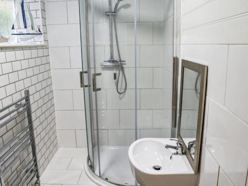 a bathroom with a sink and a shower at Lower West in Newnham