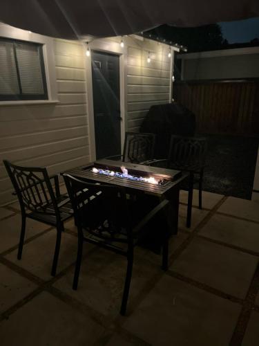 a table with lights on a patio at night at Over-Time in Galveston