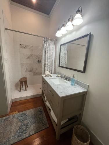 a bathroom with a sink and a shower at Over-Time in Galveston