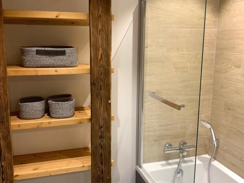 a bathroom with a shower and a tub and a sink at Chalet Valloire, 5 pièces, 8 personnes - FR-1-263-524 in Valloire