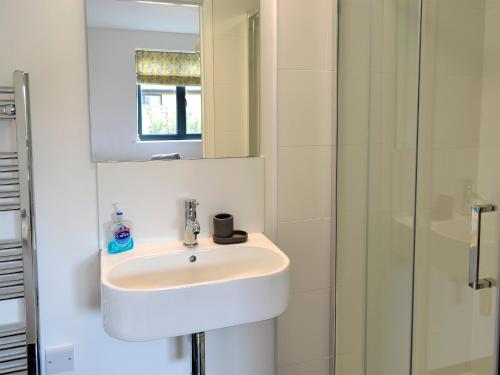 a bathroom with a sink and a shower at The Perch-uk12929 in St. Just