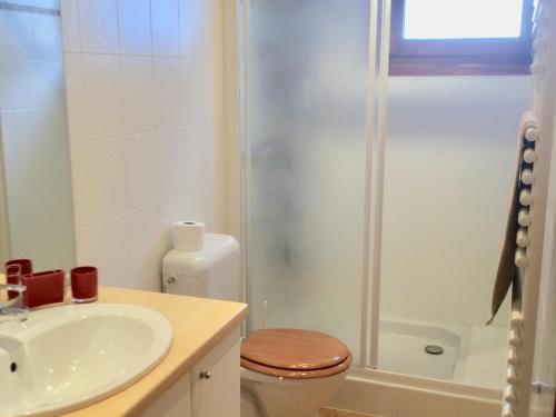 a bathroom with a toilet and a sink and a shower at Appartement Les Gets, 1 pièce, 3 personnes - FR-1-671-129 in Les Gets