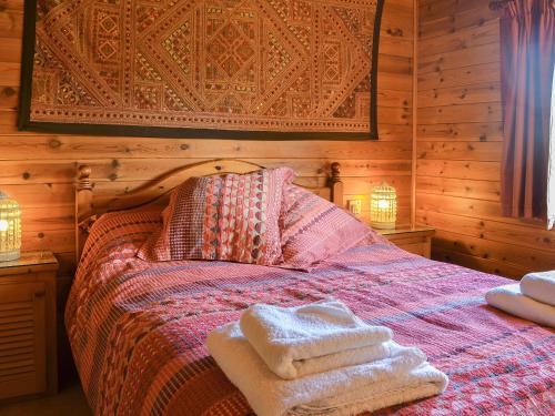 Ein Bett oder Betten in einem Zimmer der Unterkunft Ty Glan Mor the Beach House