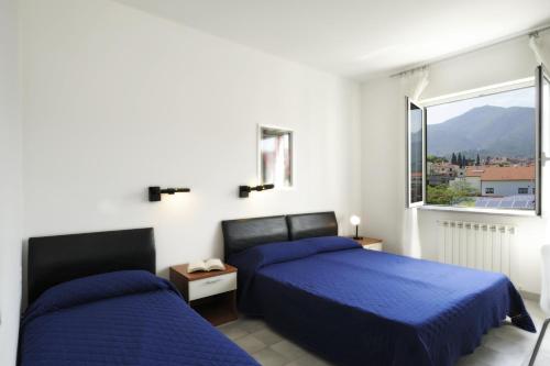 Postel nebo postele na pokoji v ubytování Residence i Cormorani