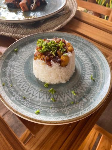 a piece of food on a plate on a table at Thani Ecobeach Barú in Playa Blanca