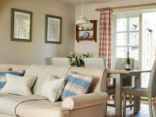 a living room with a couch and a table at Levisham in Pickering