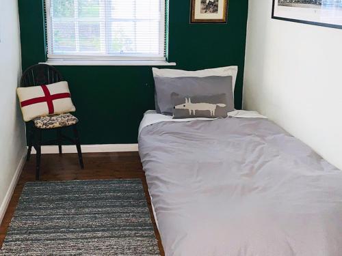เตียงในห้องที่ Winchelsea Cottage