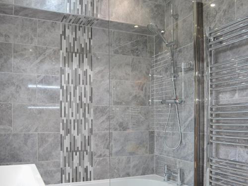a bathroom with a shower and a sink at White Towers - Hw7625 in Llanwnda