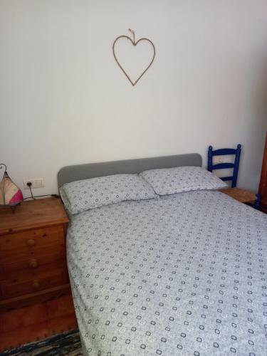 Un pat sau paturi într-o cameră la Casa Arco Iris
