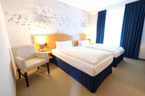 Un pat sau paturi într-o cameră la Hotel Das Lola