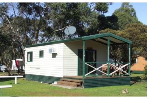 a small white building with a satellite at Discovery Parks - Kangaroo Island in Flinders Chase