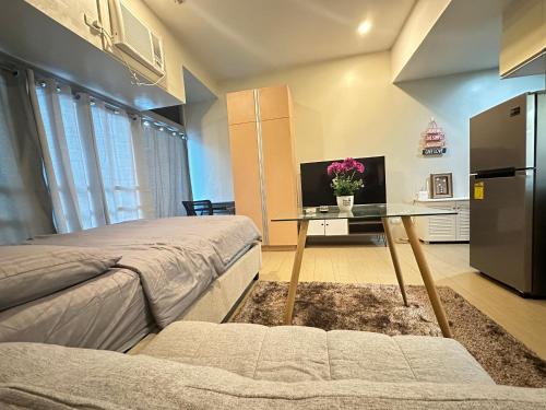 Ένα ή περισσότερα κρεβάτια σε δωμάτιο στο EJ's Staycation 4th F with 200mbps Wi-Fi and NETFLIX